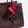 Charm med snäckskalsknot Charm med snäckskalsknot